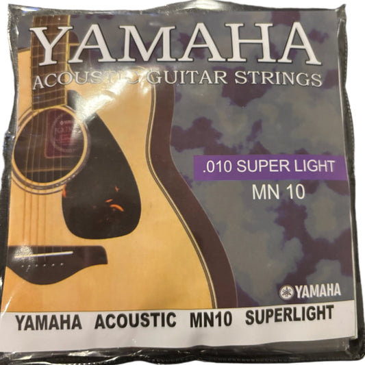 Yamaha acoustic guitar strings packaging on a dark surface